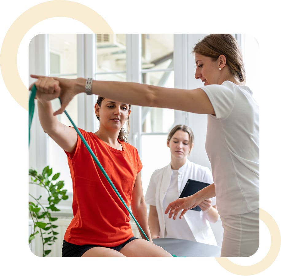 Women practicing physical therapy with resistance band.