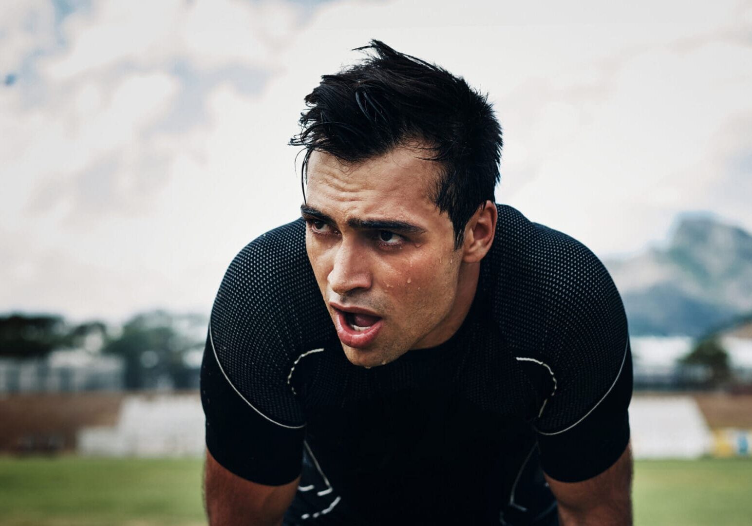 Athlete catching breath after intense workout.